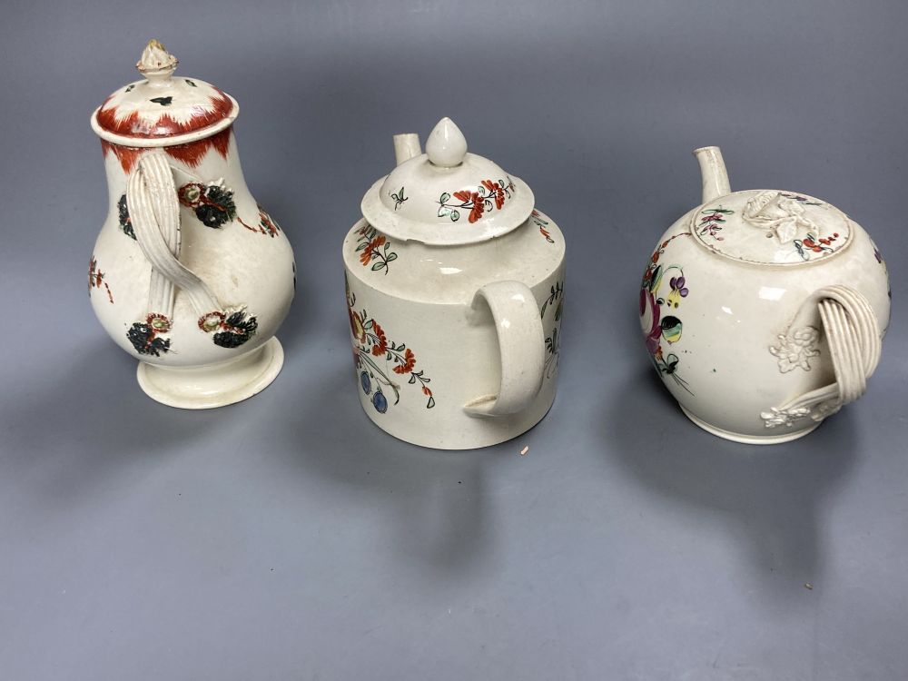 A collection of nine pieces of late 18th century creamware, including bullet-shaped teapot, 11cm high and four tea canisters with silve